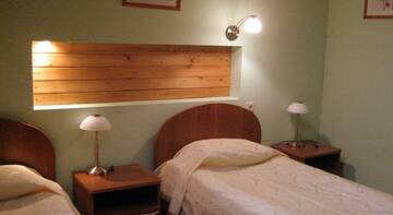 Номер стандарт с 2 односпальными кроватями в Гостинице Каргополь